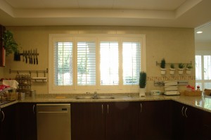 White bifold wood shutters