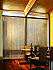 Vertical Natural Weaves blinds in a dining room