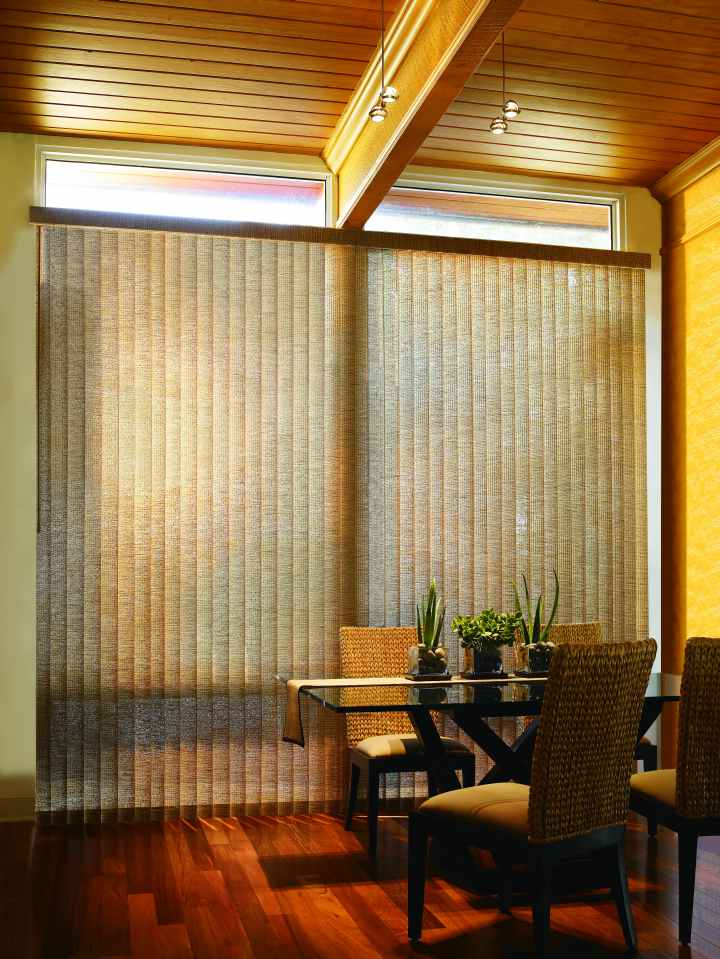 Vertical Natural Weaves blinds in a dining room
